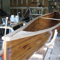 Canoe with unfinished gunwales and thwart installed